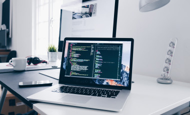 code splash in a laptop. photo by Christopher Gower