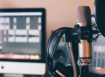 A podcasting workstation with microphone, headseat and computer